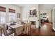 Charming dining room with hardwood floors, a fireplace, and seamless access to living room at 27 Sessions Nw St, Marietta, GA 30060