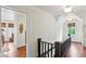 Hallway with wood floors, shiplap walls, and windows to the outside at 27 Sessions Nw St, Marietta, GA 30060