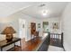 Hallway showing shiplap walls, and wood floors, with office area at 27 Sessions Nw St, Marietta, GA 30060