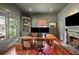 Well-appointed office with a large desk, built-in shelves, and a fireplace at 27 Sessions Nw St, Marietta, GA 30060