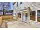 New wooden back deck with a view of the backyard, accessed via glass French doors at 3286 Bachelor Street, East Point, GA 30344