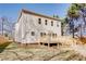 Spacious backyard features a wooden deck, grassy area, and view of the two-story house at 3286 Bachelor Street, East Point, GA 30344