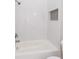 Bright bathroom featuring white subway tile, shower with tiled niche, and a tub at 3286 Bachelor Street, East Point, GA 30344