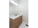 Bathroom showcasing a wood-grain vanity with a marble countertop and modern fixtures at 3286 Bachelor Street, East Point, GA 30344
