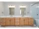 Bathroom featuring double vanity, marble countertops, modern fixtures and large mirrors at 3286 Bachelor Street, East Point, GA 30344