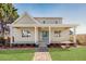 Charming home featuring a welcoming front porch, brick walkway, and well-manicured lawn at 3286 Bachelor Street, East Point, GA 30344