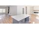 Bright, open-concept kitchen featuring a large island with quartz countertop and stainless steel hardware at 3286 Bachelor Street, East Point, GA 30344