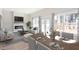 Stylish open-concept living and dining area with modern furniture and natural light at 3286 Bachelor Street, East Point, GA 30344
