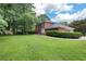 Spacious lawn for this brick home with mature trees and landscaping at 3589 Stone Ridge Trl, Douglasville, GA 30134