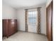 Bedroom with neutral carpet, white walls, closet, and window with curtains at 3589 Stone Ridge Trl, Douglasville, GA 30134