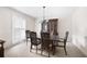 Formal dining room with classic furniture, neutral carpet, and plantation shutters at 3589 Stone Ridge Trl, Douglasville, GA 30134