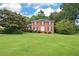 Beautiful brick home with black shutters and lush green lawn at 3589 Stone Ridge Trl, Douglasville, GA 30134