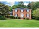 Classic brick home with black shutters, green lawn, and tasteful landscaping at 3589 Stone Ridge Trl, Douglasville, GA 30134