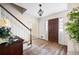 Welcoming foyer with hardwood floors, elegant staircase, and natural light at 3589 Stone Ridge Trl, Douglasville, GA 30134