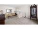 Spacious living room with ample seating, display cabinet, and neutral carpet at 3589 Stone Ridge Trl, Douglasville, GA 30134