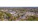 Aerial view of apartment building situated among lush trees and nearby shopping at 4282 Roswell Ne Rd # G1, Atlanta, GA 30342
