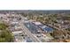 Expansive aerial shot of a community with retail spaces and tree-lined residential streets at 4282 Roswell Ne Rd # G1, Atlanta, GA 30342