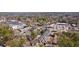 Panoramic aerial view showcasing a community near shopping centers, surrounded by trees at 4282 Roswell Ne Rd # G1, Atlanta, GA 30342