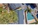 High-angle view focusing on a building's roof, adjacent to a community pool and surrounding greenery at 4282 Roswell Ne Rd # G1, Atlanta, GA 30342