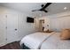 Bedroom with hardwood floors, modern ceiling fan, closet, and television on the wall at 4282 Roswell Ne Rd # G1, Atlanta, GA 30342
