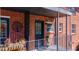 Brick building with black front door, decorated with wrought iron decor at 4282 Roswell Ne Rd # G1, Atlanta, GA 30342