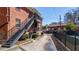 Backside of brick apartment building with outdoor metal staircases and balconies at 4282 Roswell Ne Rd # G1, Atlanta, GA 30342