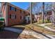 Brick apartment building with green door and mature trees at 4282 Roswell Ne Rd # G1, Atlanta, GA 30342