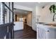 An open-concept kitchen with stainless steel appliances and marble countertops offers a welcoming view of the living area at 4282 Roswell Ne Rd # G1, Atlanta, GA 30342