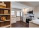 Bright kitchen with stainless appliances, stylish breakfast bar seating and view to an accent shelving unit at 4282 Roswell Ne Rd # G1, Atlanta, GA 30342