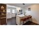 Bright kitchen with stainless appliances, stylish breakfast bar seating, and elegant white cabinetry create a modern, inviting space at 4282 Roswell Ne Rd # G1, Atlanta, GA 30342