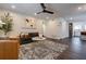 Bright living room features a ceiling fan, hardwood floors, and comfortable seating arrangements at 4282 Roswell Ne Rd # G1, Atlanta, GA 30342