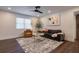 Bright living room features a ceiling fan, hardwood floors, and comfortable seating arrangements at 4282 Roswell Ne Rd # G1, Atlanta, GA 30342