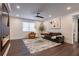 Bright living room features a ceiling fan, hardwood floors, and comfortable seating arrangements at 4282 Roswell Ne Rd # G1, Atlanta, GA 30342