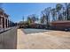 Community pool is surrounded by black fence and trees in the background at 4282 Roswell Ne Rd # G1, Atlanta, GA 30342