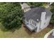 Aerial view of the backyard featuring a deck and lush green lawn at 4815 Rapids Nw Cir, Acworth, GA 30102