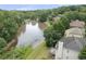 Back view shows a deck and a large pond surrounded by mature trees at 4815 Rapids Nw Cir, Acworth, GA 30102
