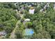 Drone photo displays the tennis courts and pool located near the lake at 4815 Rapids Nw Cir, Acworth, GA 30102