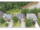 Aerial view of homes shows mature landscaping and lakefront property at 4815 Rapids Nw Cir, Acworth, GA 30102