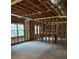Spacious unfinished basement, exposed wooden framing and concrete floor, offering customization potential at 4815 Rapids Nw Cir, Acworth, GA 30102