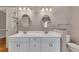 Well-lit bathroom featuring double sinks, modern fixtures, and ample cabinet space at 4815 Rapids Nw Cir, Acworth, GA 30102