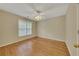 Bright bedroom with hardwood floors, a ceiling fan, and natural light from the window at 4815 Rapids Nw Cir, Acworth, GA 30102