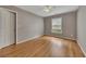 Bedroom featuring hardwood floors, natural light, and a neutral color scheme at 4815 Rapids Nw Cir, Acworth, GA 30102
