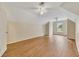 Spacious bedroom featuring hardwood floors, dormer windows, and two ceiling fans at 4815 Rapids Nw Cir, Acworth, GA 30102