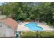 Image shows the community pool with lounge chairs and umbrellas at 4815 Rapids Nw Cir, Acworth, GA 30102