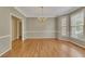 Formal dining room with hardwood floors, chandelier, and large windows at 4815 Rapids Nw Cir, Acworth, GA 30102