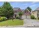 Charming brick two-story home with a two car garage and mature landscaping at 4815 Rapids Nw Cir, Acworth, GA 30102
