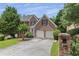 Charming brick two-story home with a two car garage and mature landscaping at 4815 Rapids Nw Cir, Acworth, GA 30102