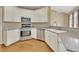 Kitchen with stainless steel appliances, granite countertops, and white cabinets at 4815 Rapids Nw Cir, Acworth, GA 30102