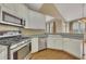 Open kitchen area featuring white cabinets and view to dining area at 4815 Rapids Nw Cir, Acworth, GA 30102