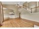 Bright living room with hardwood floors and staircase at 4815 Rapids Nw Cir, Acworth, GA 30102